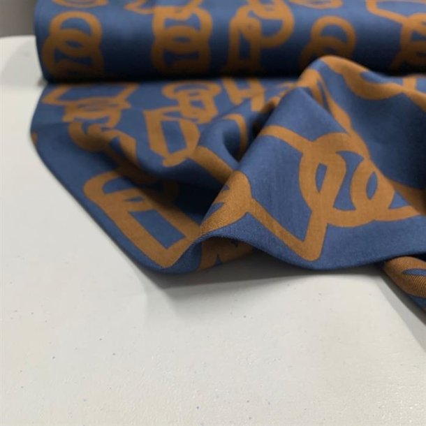 Bld viskose i bl med mnster i brun sukker - pr. 0,25 meter